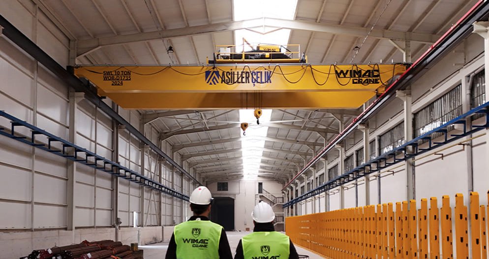 Heavy-duty double girder overhead bridge crane with parallel main girders, top-running trolley and forged steel end carriages